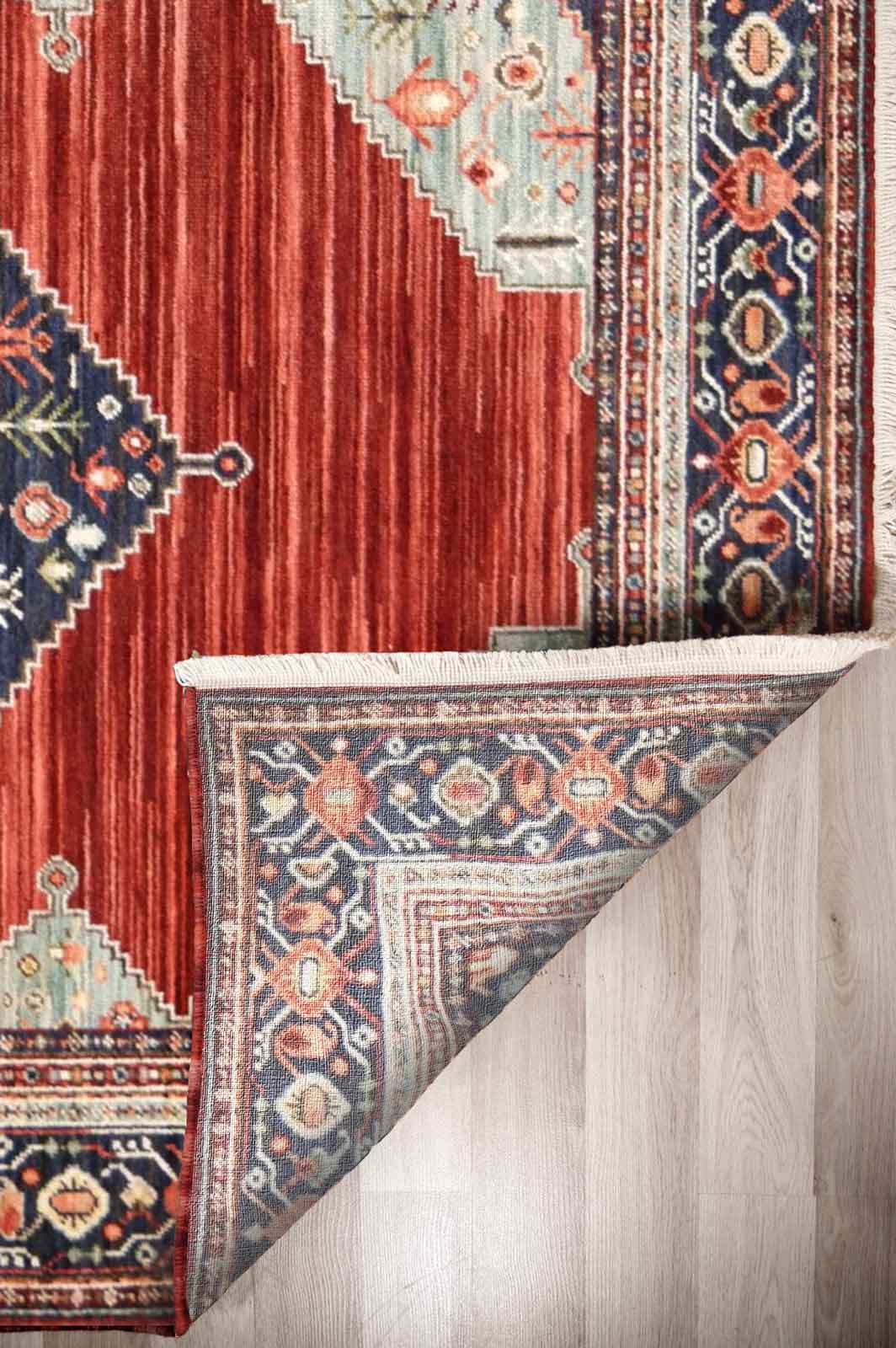 Walter Bazaar Spice rug – red traditional wool rug with navy medallion. Available at Rugs N Timber in Belrose
