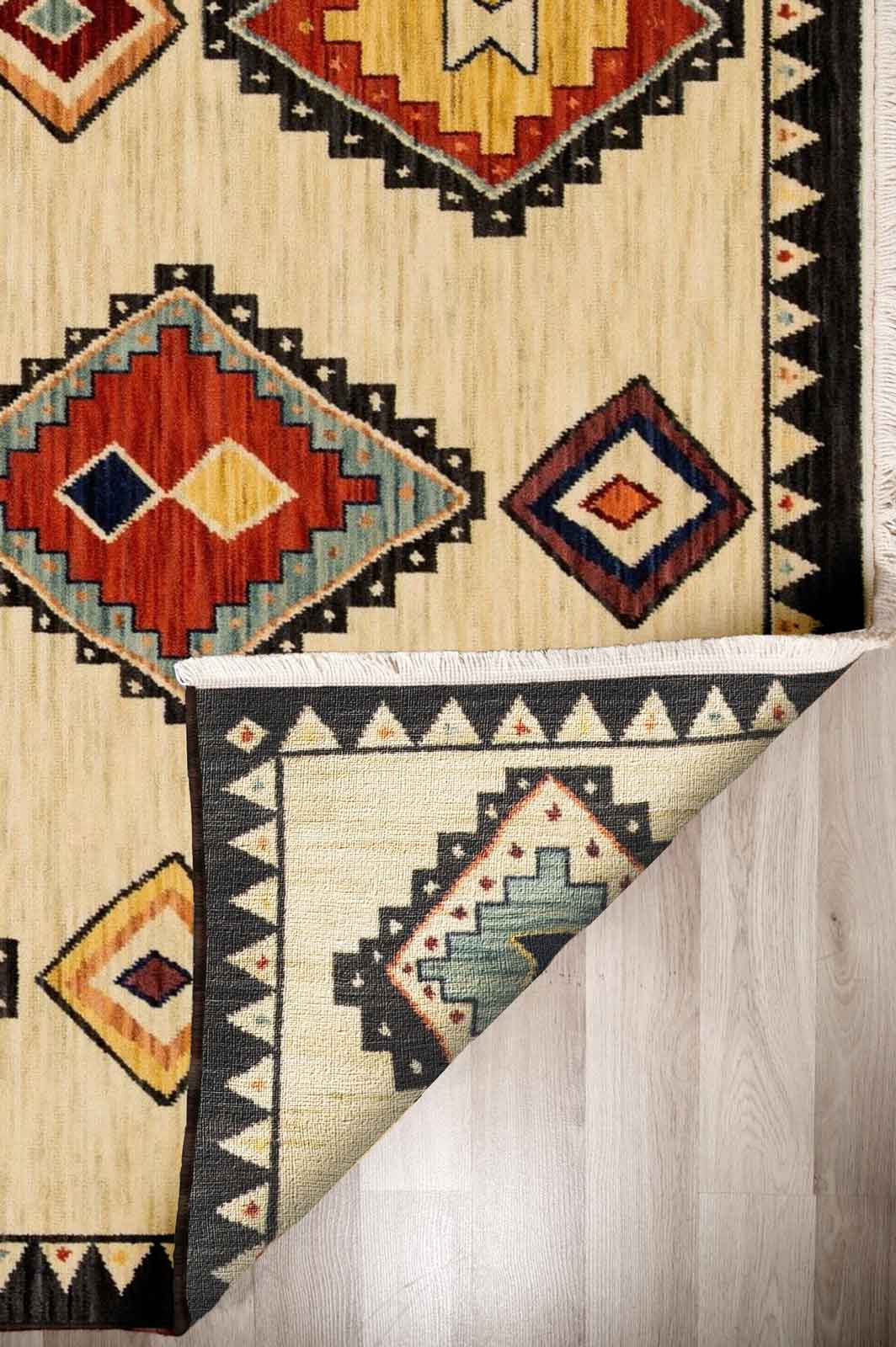 Walter Nomad Sand rug – tribal wool rug with cream base and colourful geometric diamond patterns, inspired by traditional design. Available at Rugs N Timber Belrose