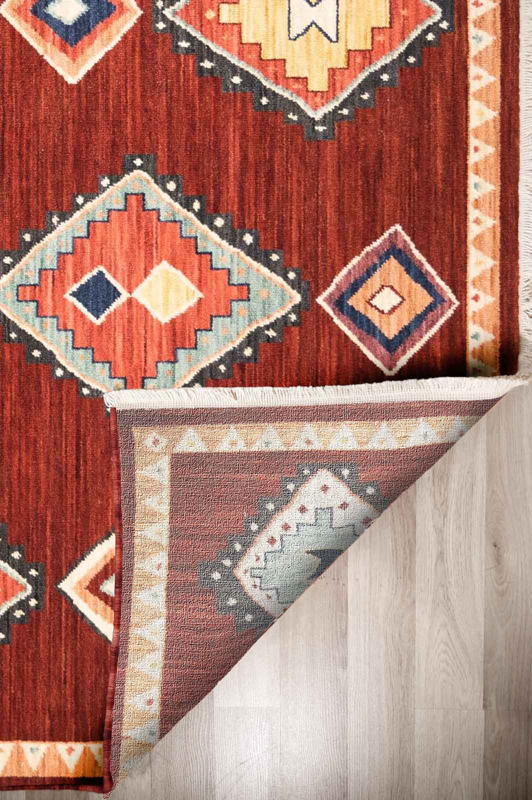 Walter Nomad Spice rug – traditional tribal wool rug in deep red tones with colourful geometric diamond motifs. Available at Rugs N Timber Belrose.