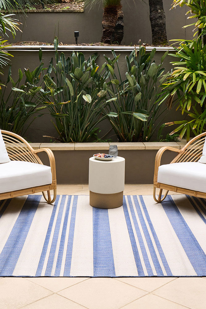 Ariel Blue outdoor rug – coastal striped flatweave design in blue and ivory, perfect for patios, decks, and indoor-outdoor spaces.
