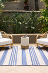 Ariel Blue outdoor rug – coastal striped flatweave design in blue and ivory, perfect for patios, decks, and indoor-outdoor spaces.