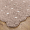 Como Mushroom rug – soft cotton kids rug in warm taupe with scalloped edge and dotted pattern, perfect for bedrooms and nurseries. Available at Rugs N Timber Belrose