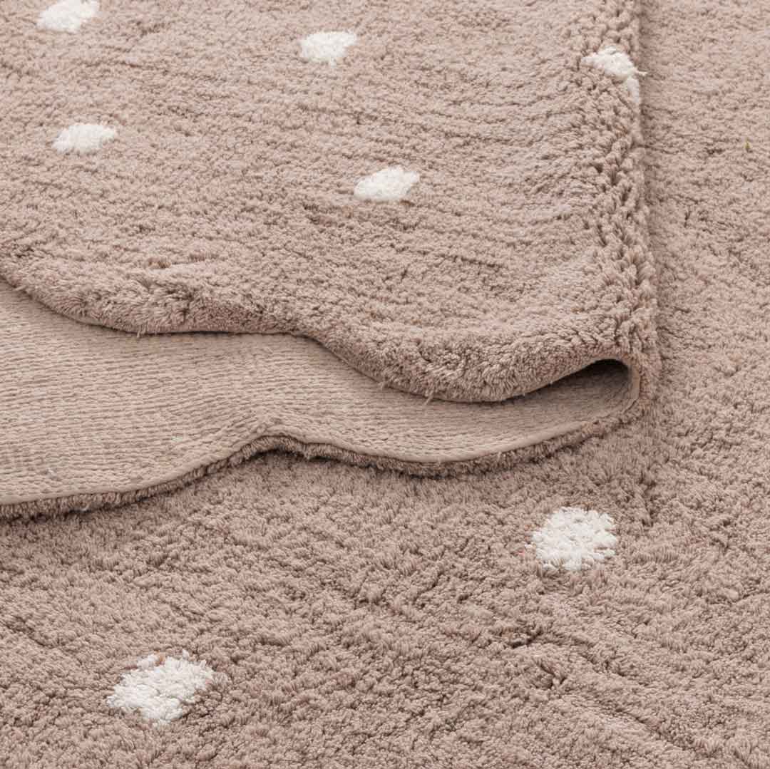 Como Mushroom rug – soft cotton kids rug in warm taupe with scalloped edge and dotted pattern, perfect for bedrooms and nurseries. Available at Rugs N Timber Belrose