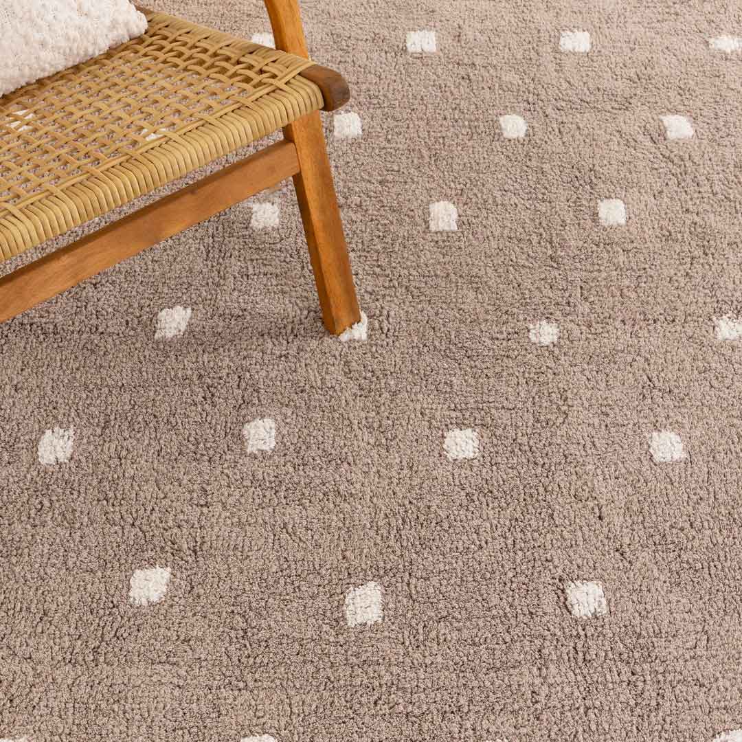 Como Mushroom rug – soft cotton kids rug in warm taupe with scalloped edge and dotted pattern, perfect for bedrooms and nurseries. Available at Rugs N Timber Belrose