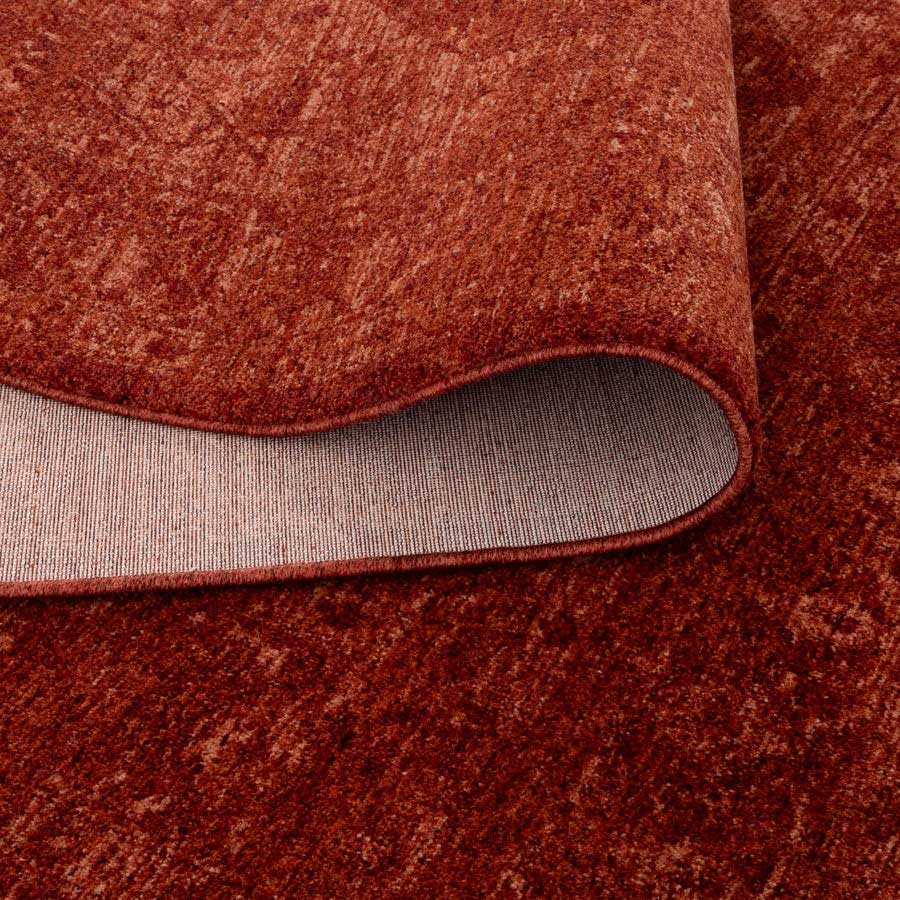 Vienna Château Rust Rug showing non-shedding backing and flexible fold, power-loomed for durability – see this rug in-store at Rugs N Timber Belrose.