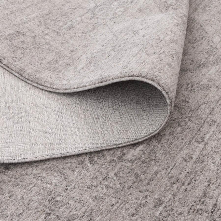 Vienna Château Silver Rug showing non-shedding backing and flexible fold, power-loomed for durability – see this rug in-store at Rugs N Timber Belrose.