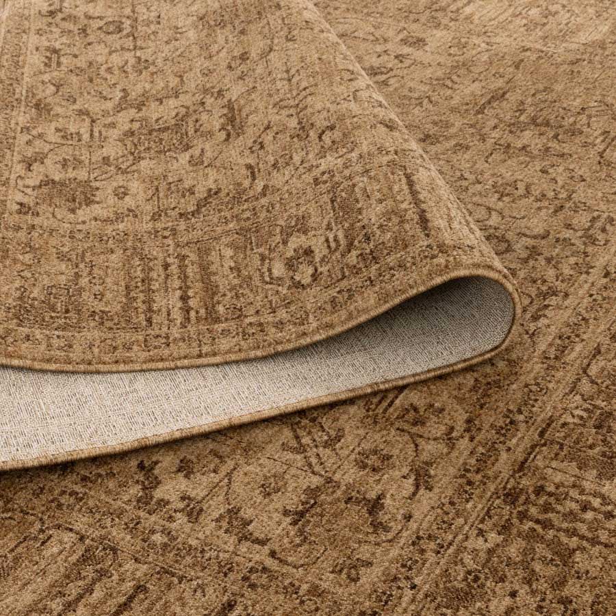 Vienna Manor Caramel Rug showing non-shedding backing and flexible fold, power-loomed for durability – see this rug in-store at Rugs N Timber Belrose.