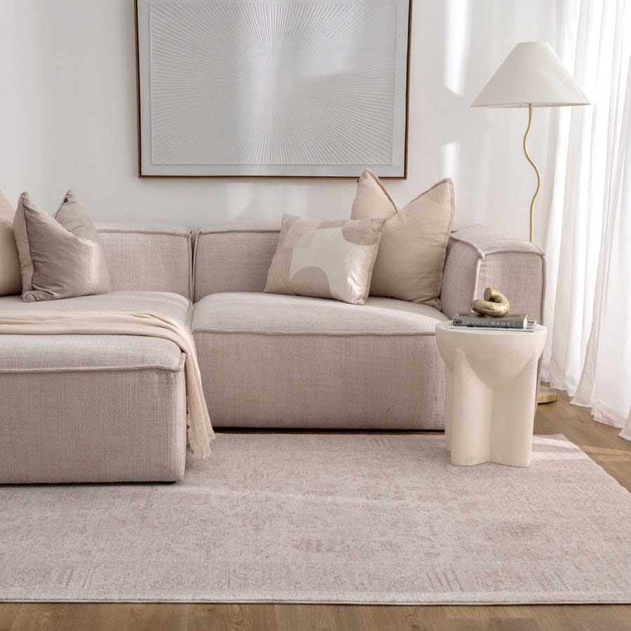 Vienna Manor Ivory Rug styled in modern living room with neutral sofa and soft lighting – view this design at our Belrose showroom, Northern Beaches.