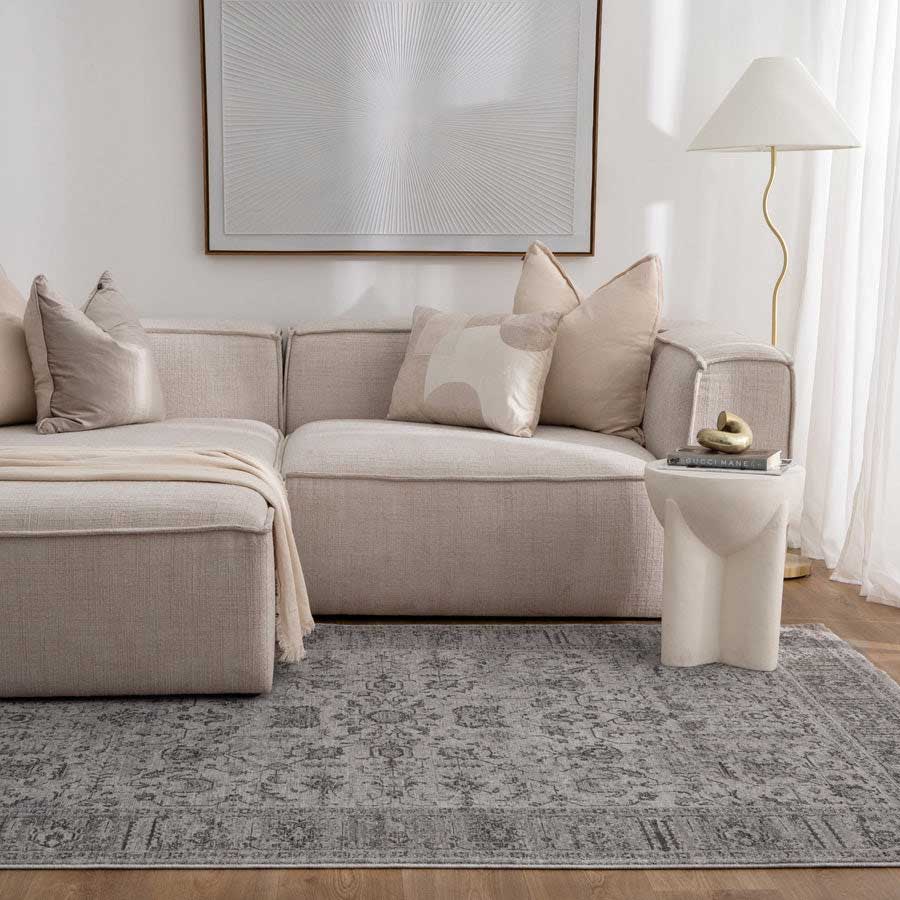 Vienna Manor Stone Rug styled in modern living room with neutral sofa and soft lighting – view this design at our Belrose showroom, Northern Beaches.