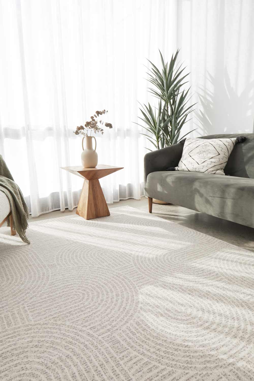Living room showcasing the Madelyn Contour wool rug in neutral tones