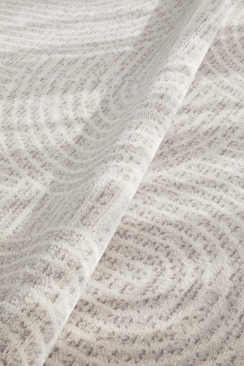 Close-up of Madelyn Contour Rug's wool fabric with a subtle pattern