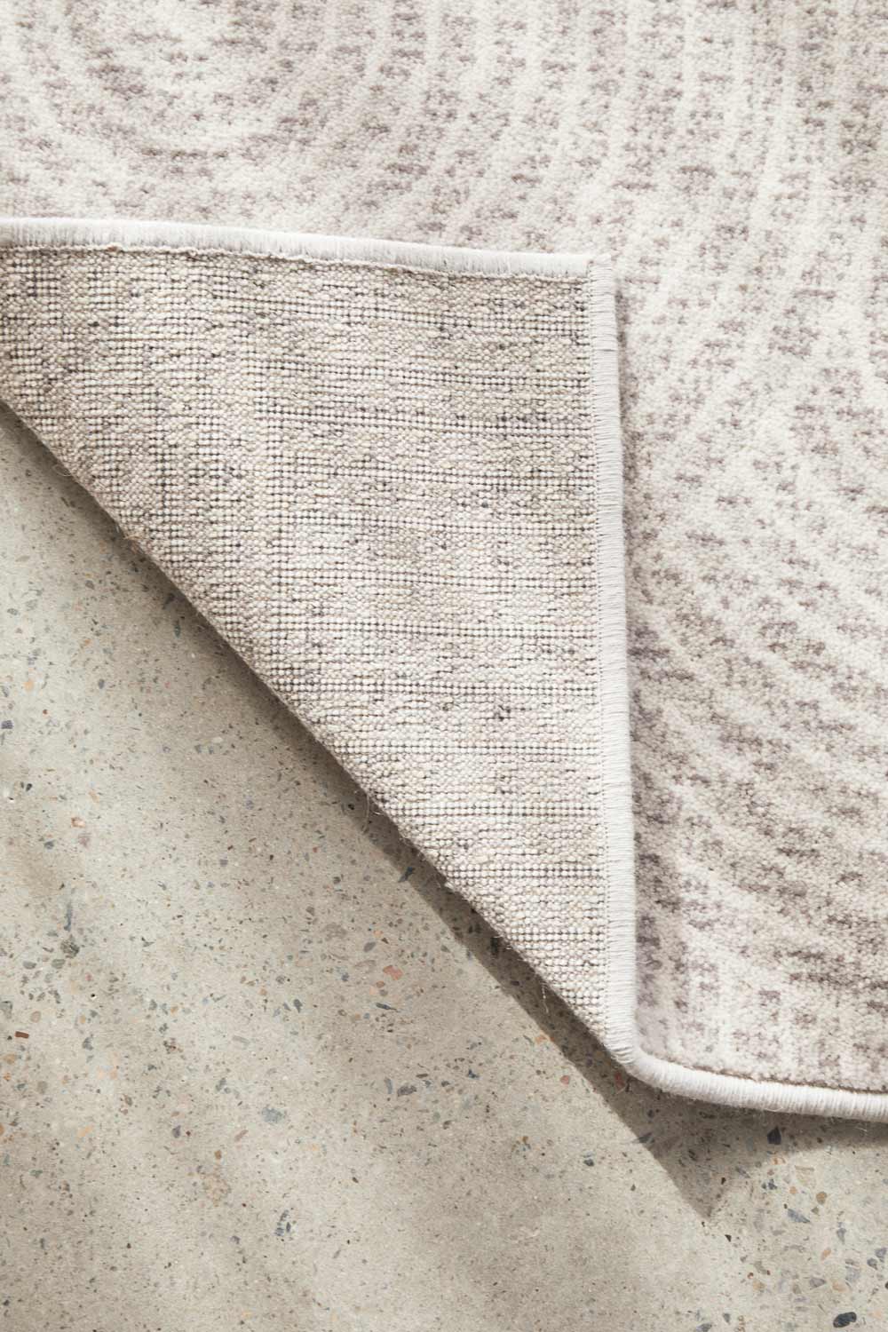 Close-up of Madelyn Contour Rug's wool fabric with a subtle pattern