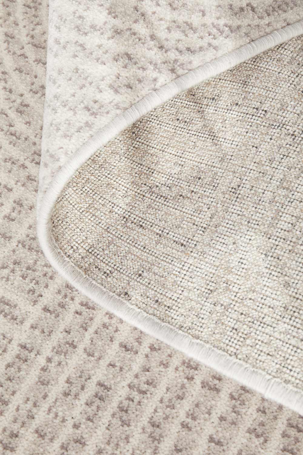Close-up of Madelyn Contour Rug's wool fabric and underside