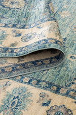 Azure Garden Afghan wool rug — teal field with floral medallions and cream border — handmade, natural dyes