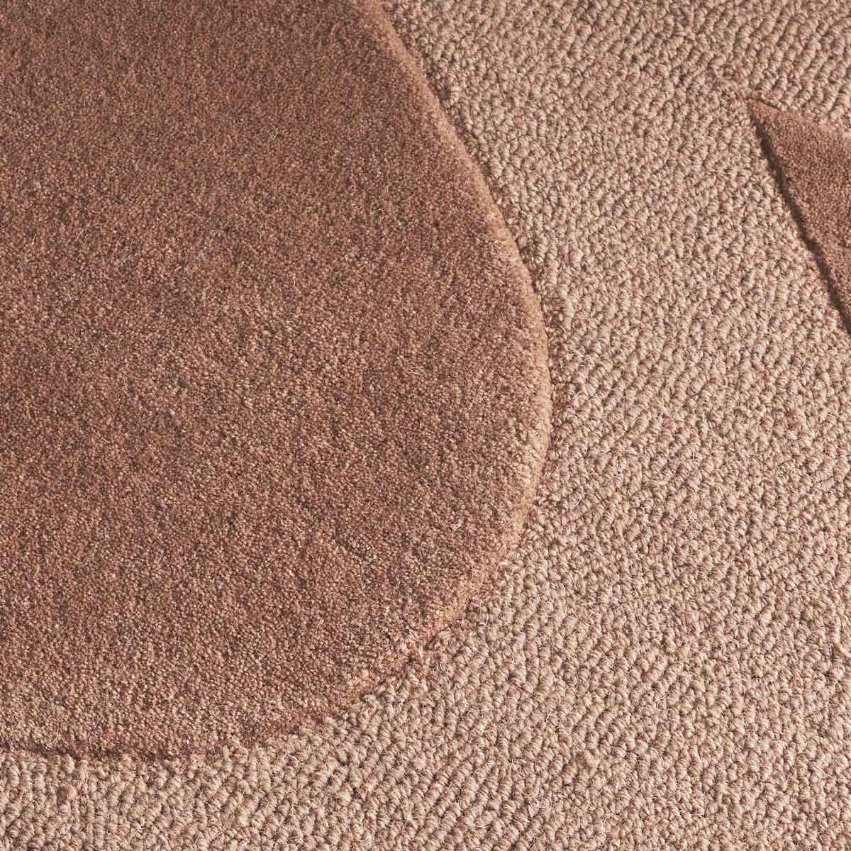 Canyon Nude hand tufted wool rug with curved abstract design in soft peach and beige tones