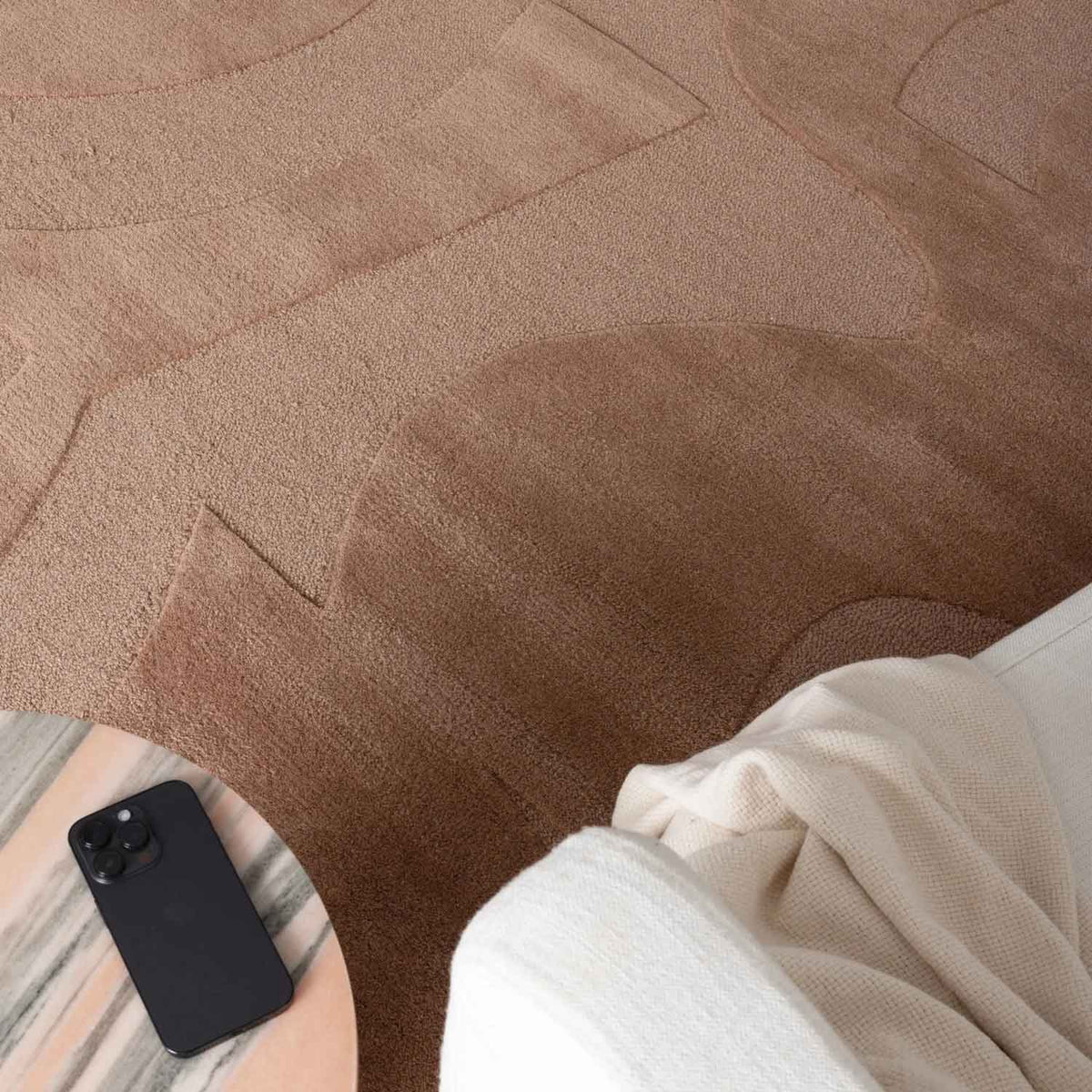 Canyon Nude hand tufted wool rug with curved abstract design in soft peach and beige tones