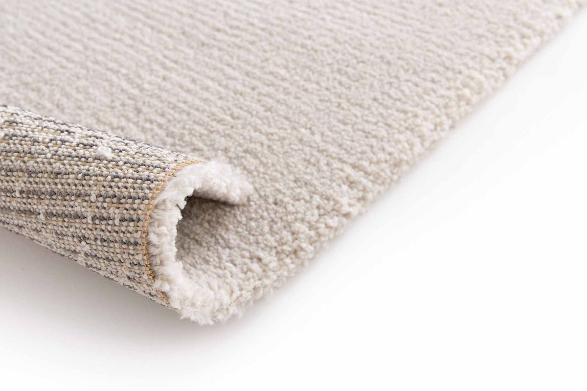 Cedric Pearl ivory rug with subtle silver highlights and soft plush pile. Available at Rugs N Timber Belrose.