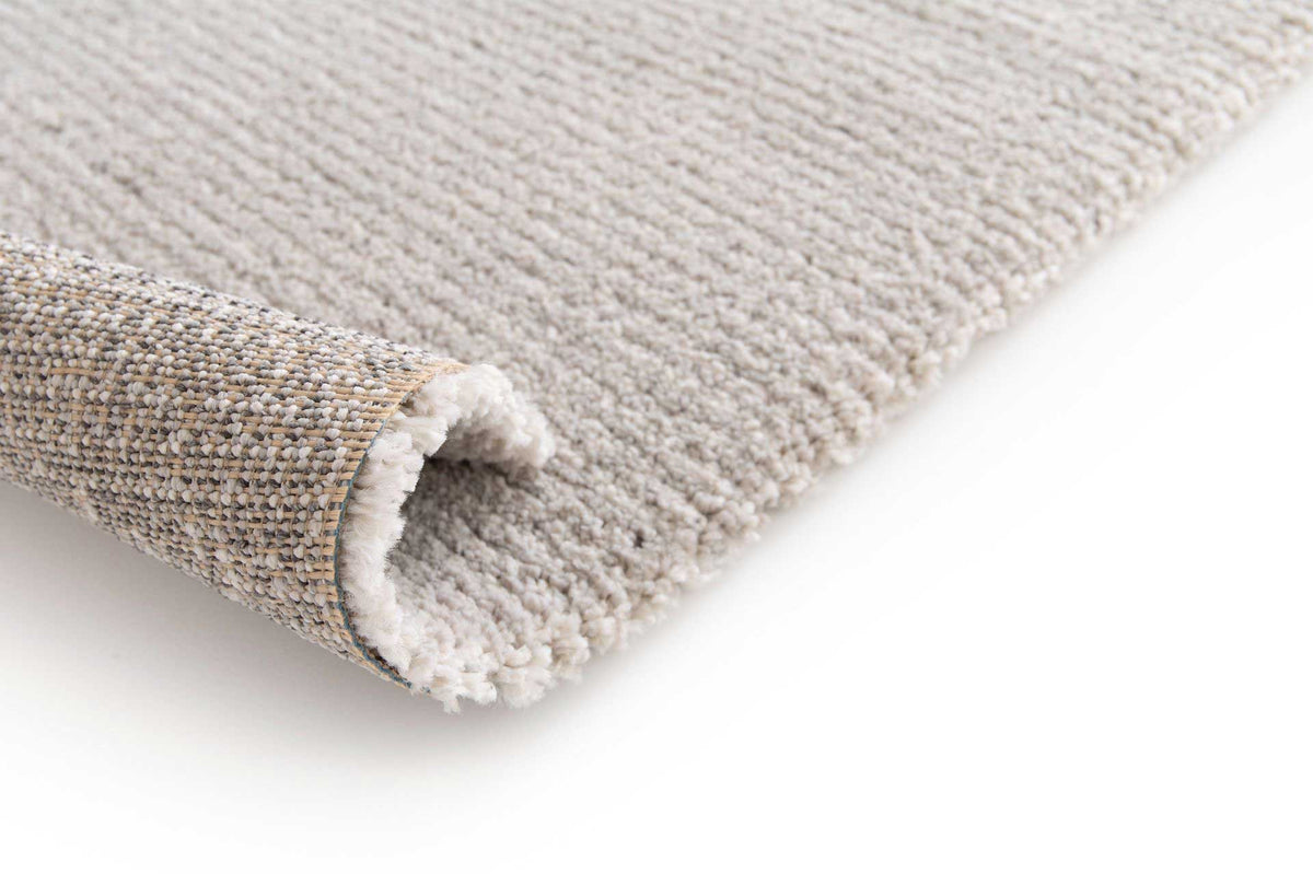 Cedric Silver contemporary grey rug with subtle ivory highlights. Available at Rugs N Timber Belrose.
