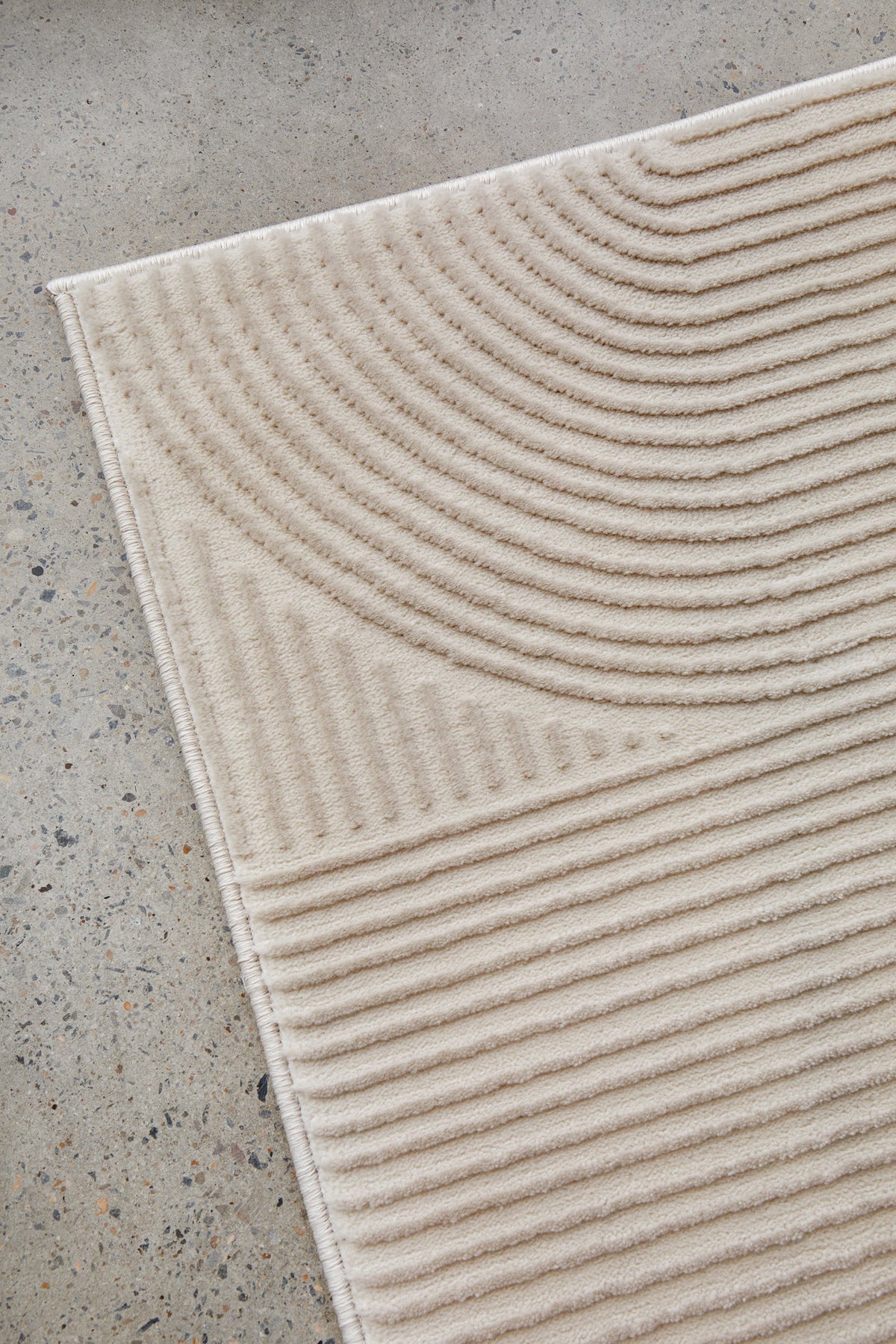 Colette Linen rug with soft arch pattern and neutral tones available at Rugs N Timber Belrose showroom