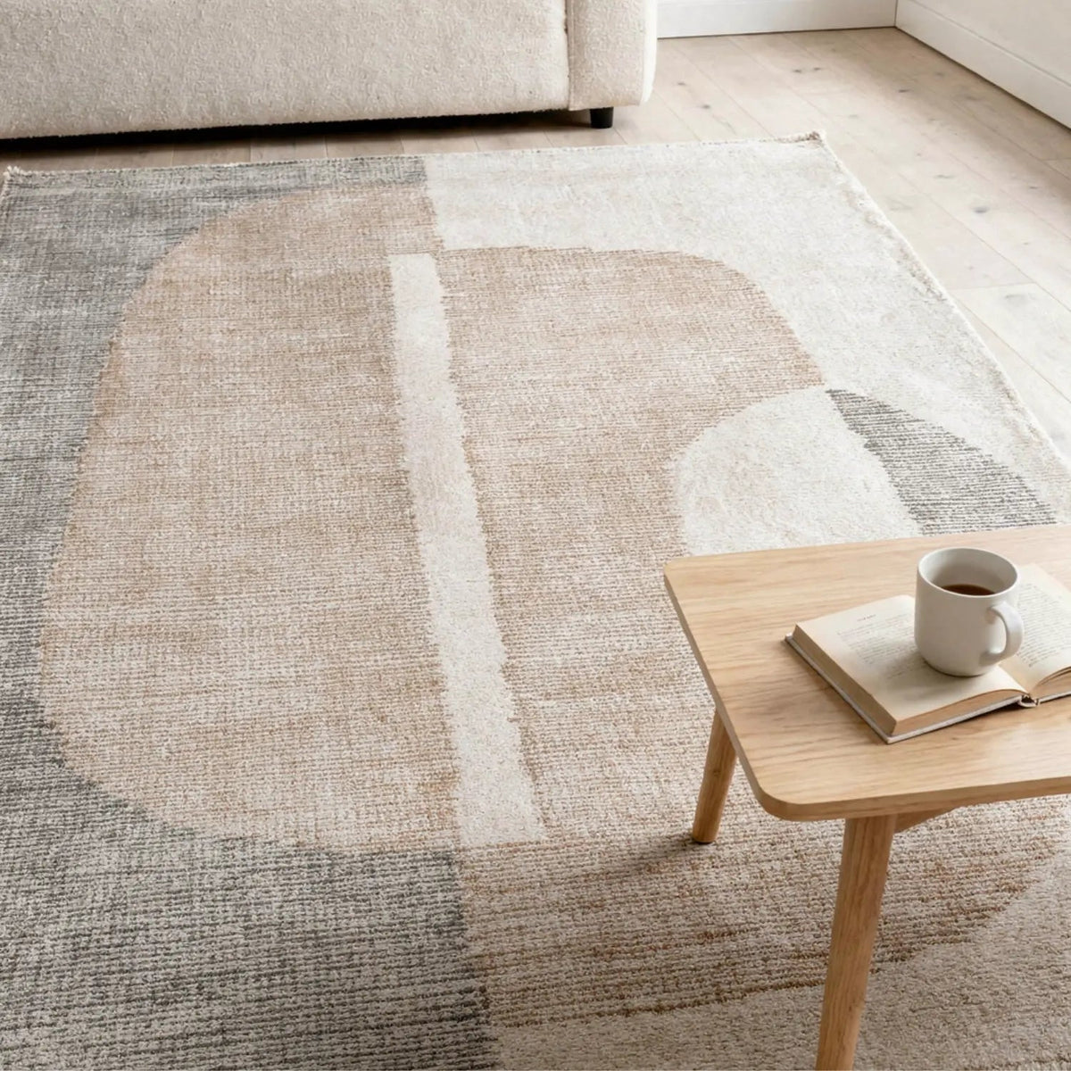Cove Stone wool rug with large abstract design in ivory, stone and warm neutral tones