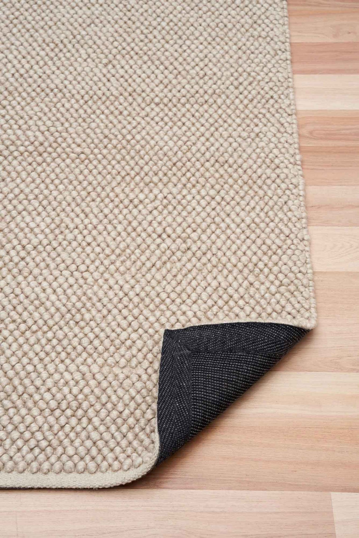 Eugene Sandstone Rug – natural wool blend loop-pile rug available at Rugs N Timber Belrose showroom
