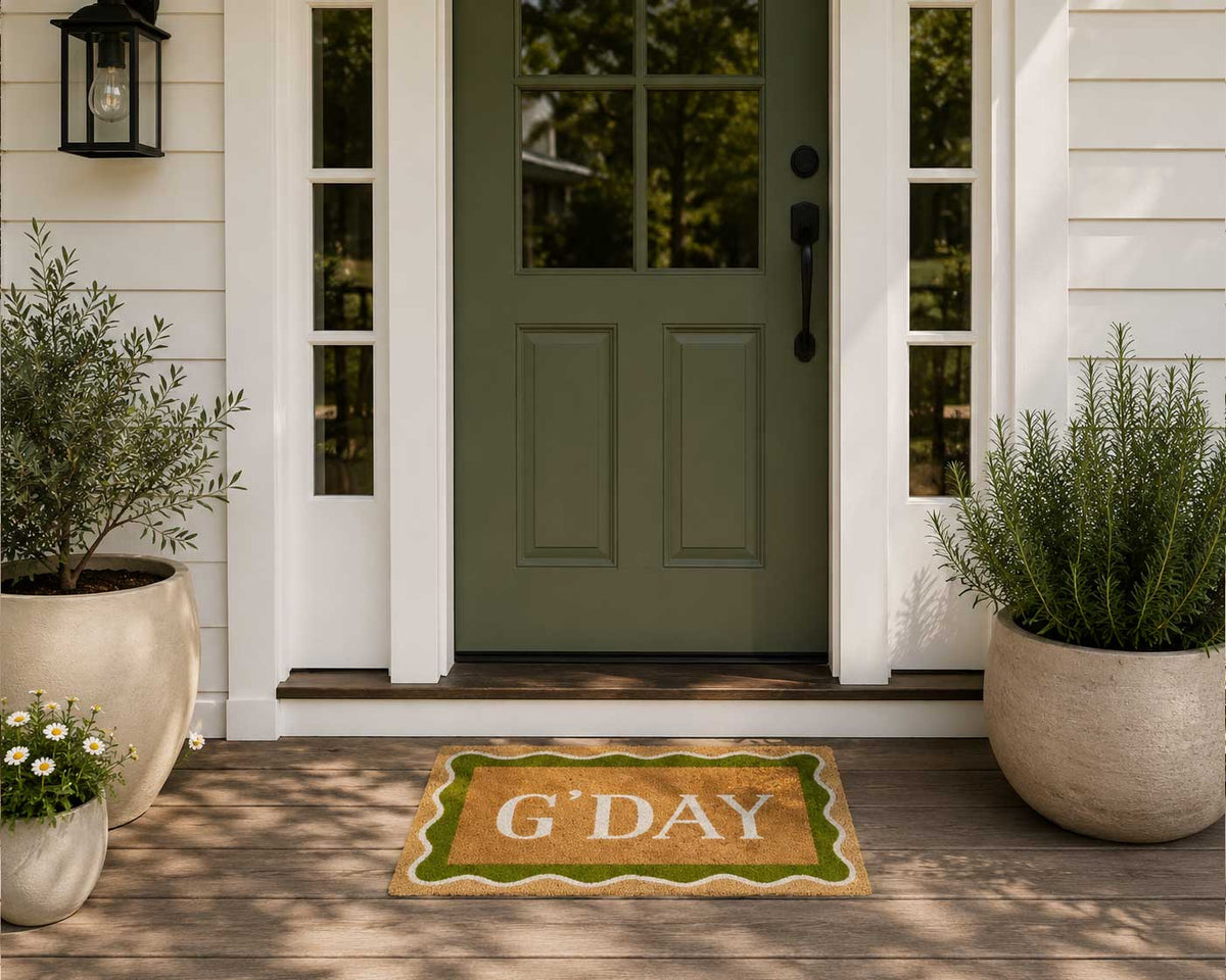 G'Day coir doormat with olive green wavy border and white lettering