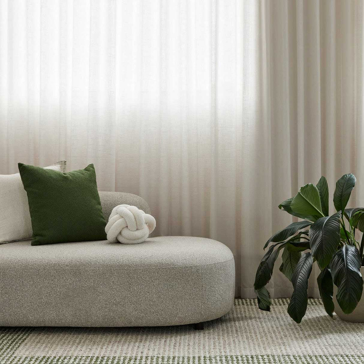 Grove green and ivory hand-woven wool rug with contrasting border design