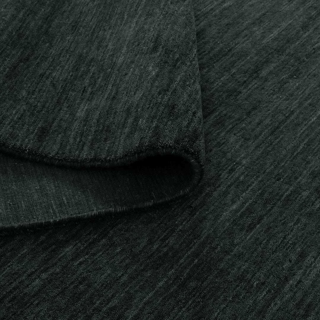 Havana Domino hand knotted wool blend rug in deep charcoal tones at Rugs N Timber Belrose
