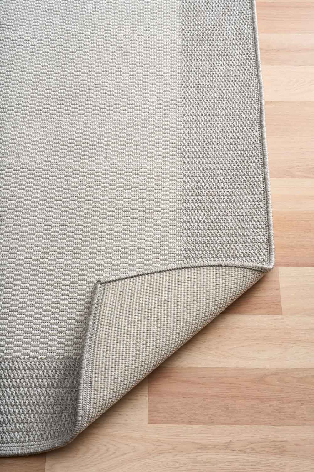 Linden Border Silver indoor outdoor rug with a light centre and soft grey framed edge. Available at Rugs N Timber Belrose