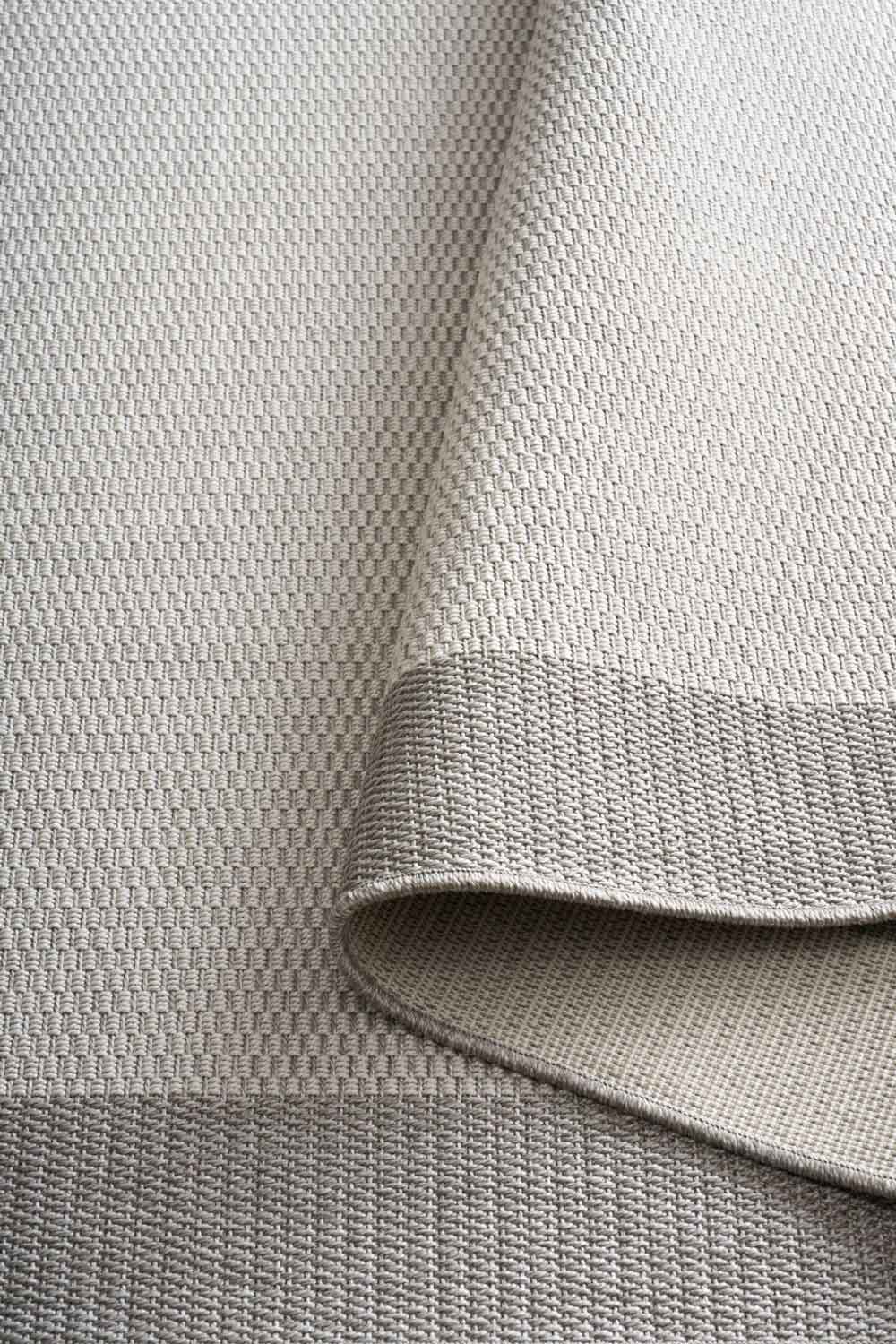 Linden Border Silver indoor outdoor rug with a light centre and soft grey framed edge. Available at Rugs N Timber Belrose