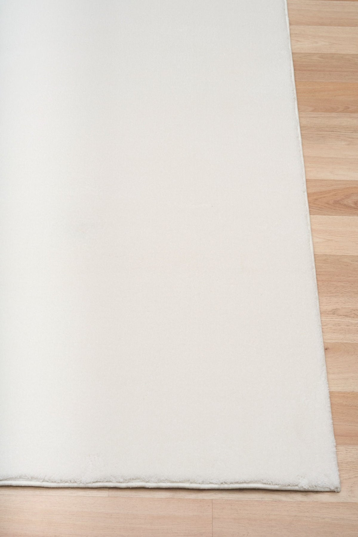 Monty Ivory Rug – soft minimalist polyester rug with silky texture, available at Rugs N Timber Belrose