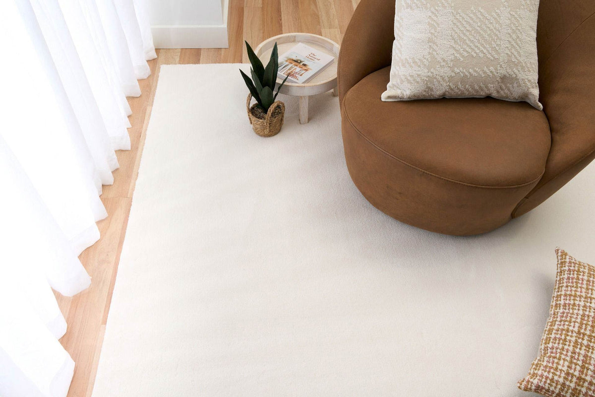 Monty Ivory Rug – soft minimalist polyester rug with silky texture, available at Rugs N Timber Belrose