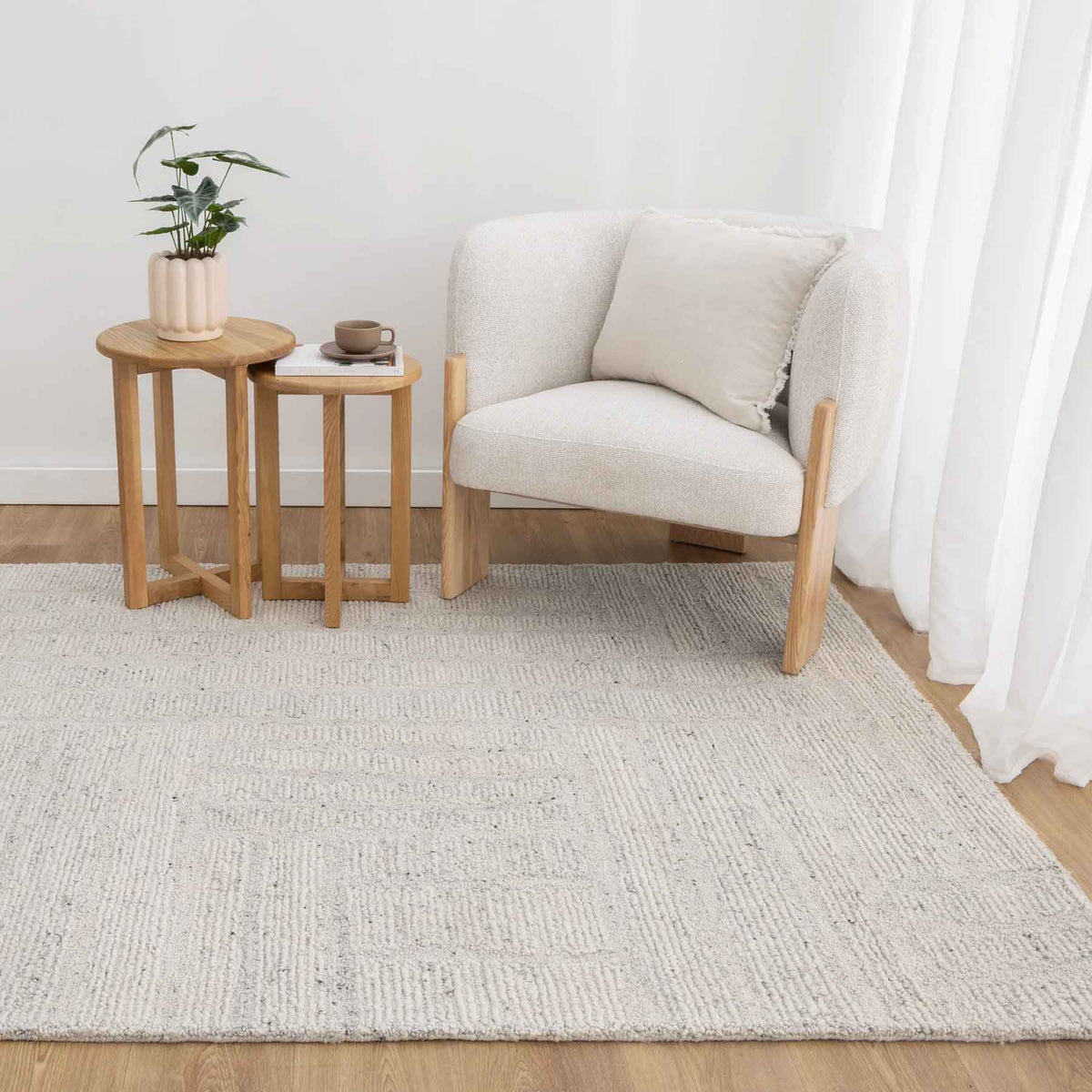 Nebraska Frost light silver wool rug featuring modern boucle weave, available at Rugs N Timber Belrose.