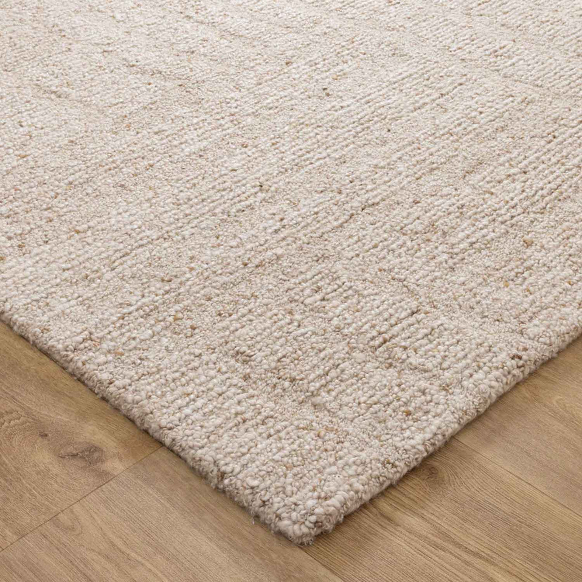 Nebraska Linen beige wool rug with soft 20mm boucle pile, available at Rugs N Timber Belrose showroom.
