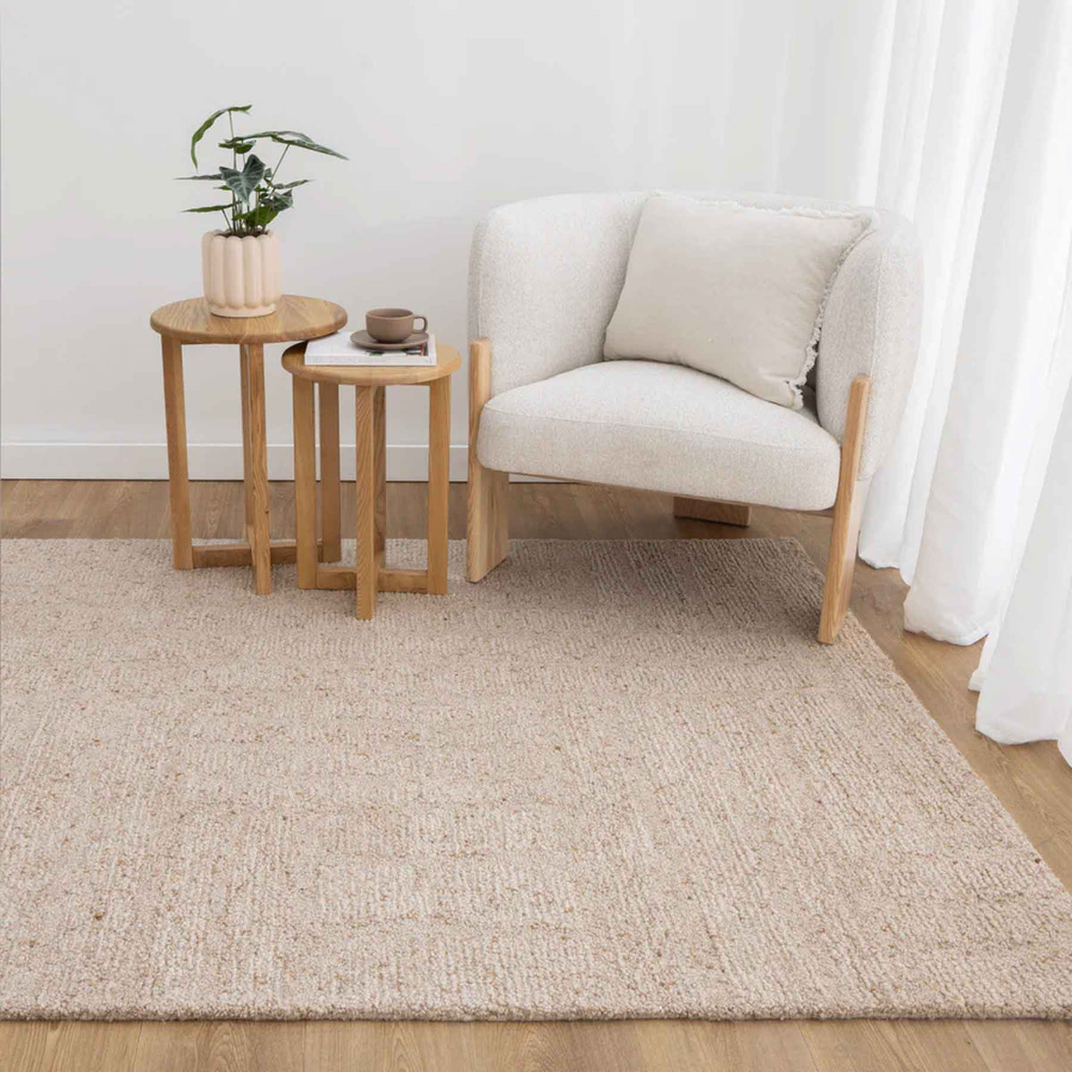 Nebraska Linen beige wool rug with soft 20mm boucle pile, available at Rugs N Timber Belrose showroom.