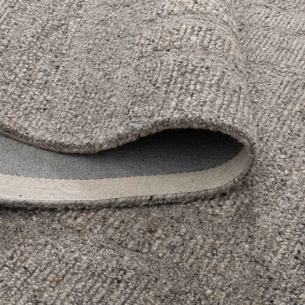 Nebraska Timber wool rug with boucle texture in warm brown-grey tones, available at Rugs N Timber Belrose showroom.