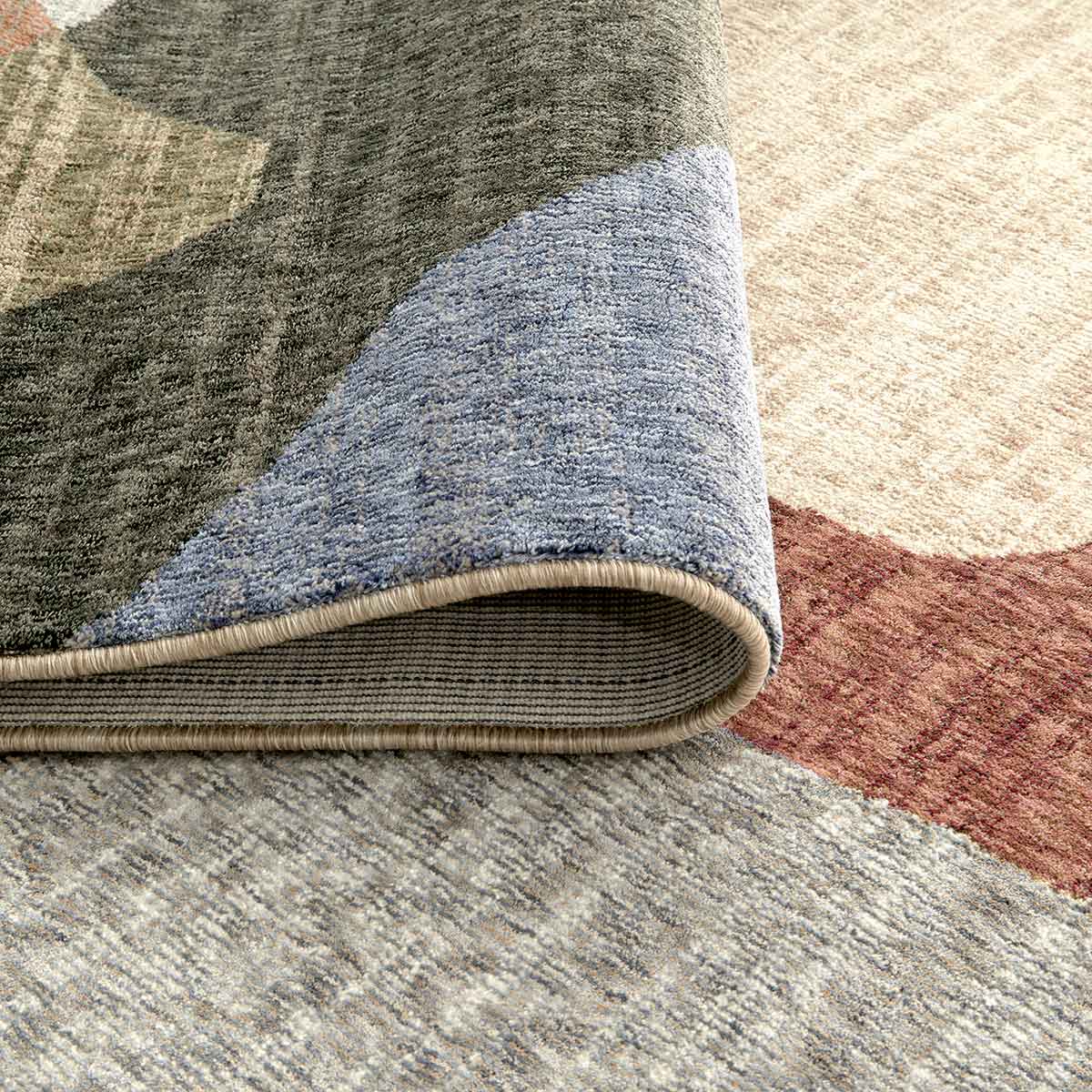 Ophelia Atelier contemporary abstract rug with flowing organic shapes and warm earthy colours.