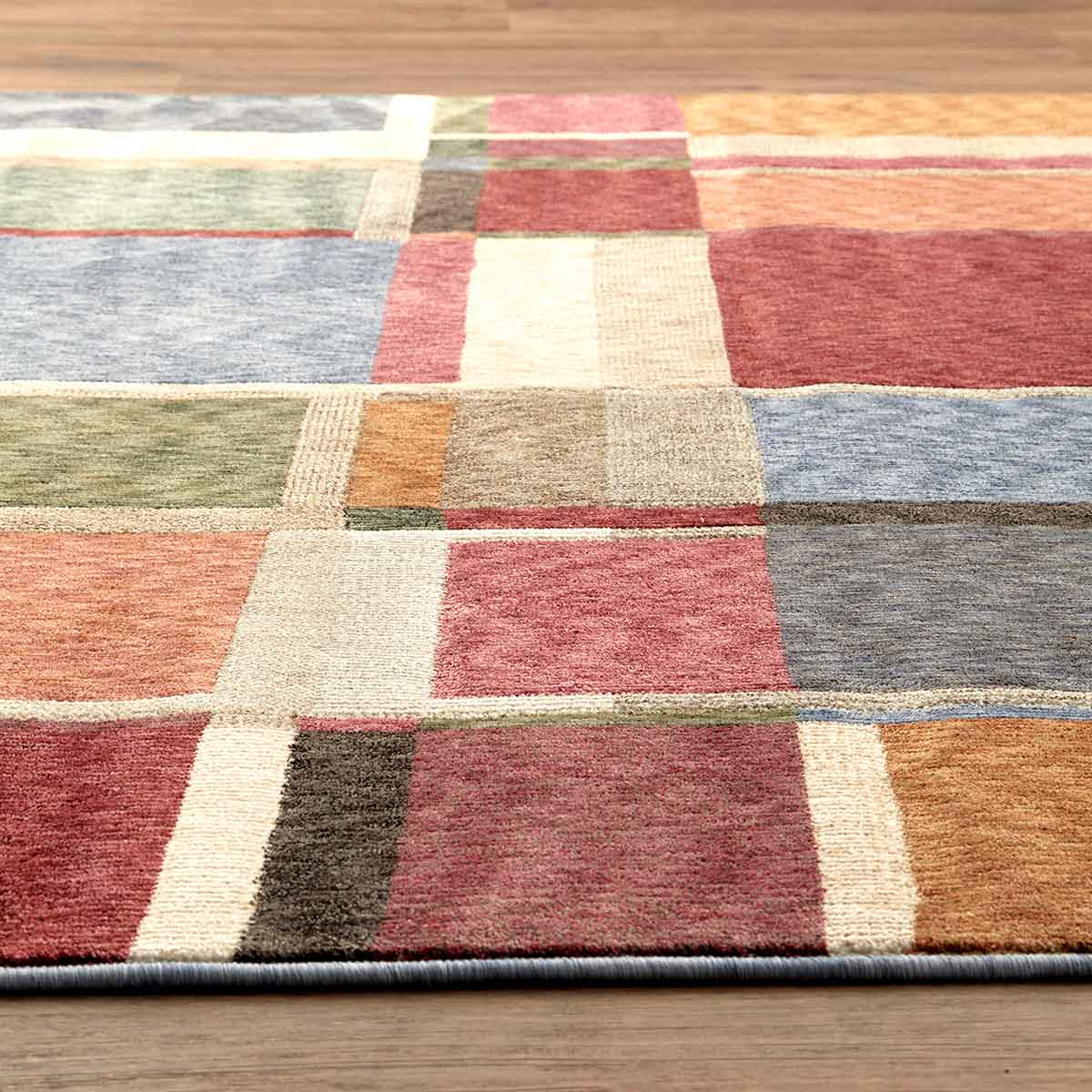 Ophelia Grid contemporary geometric rug featuring layered earthy tones and architectural lines.