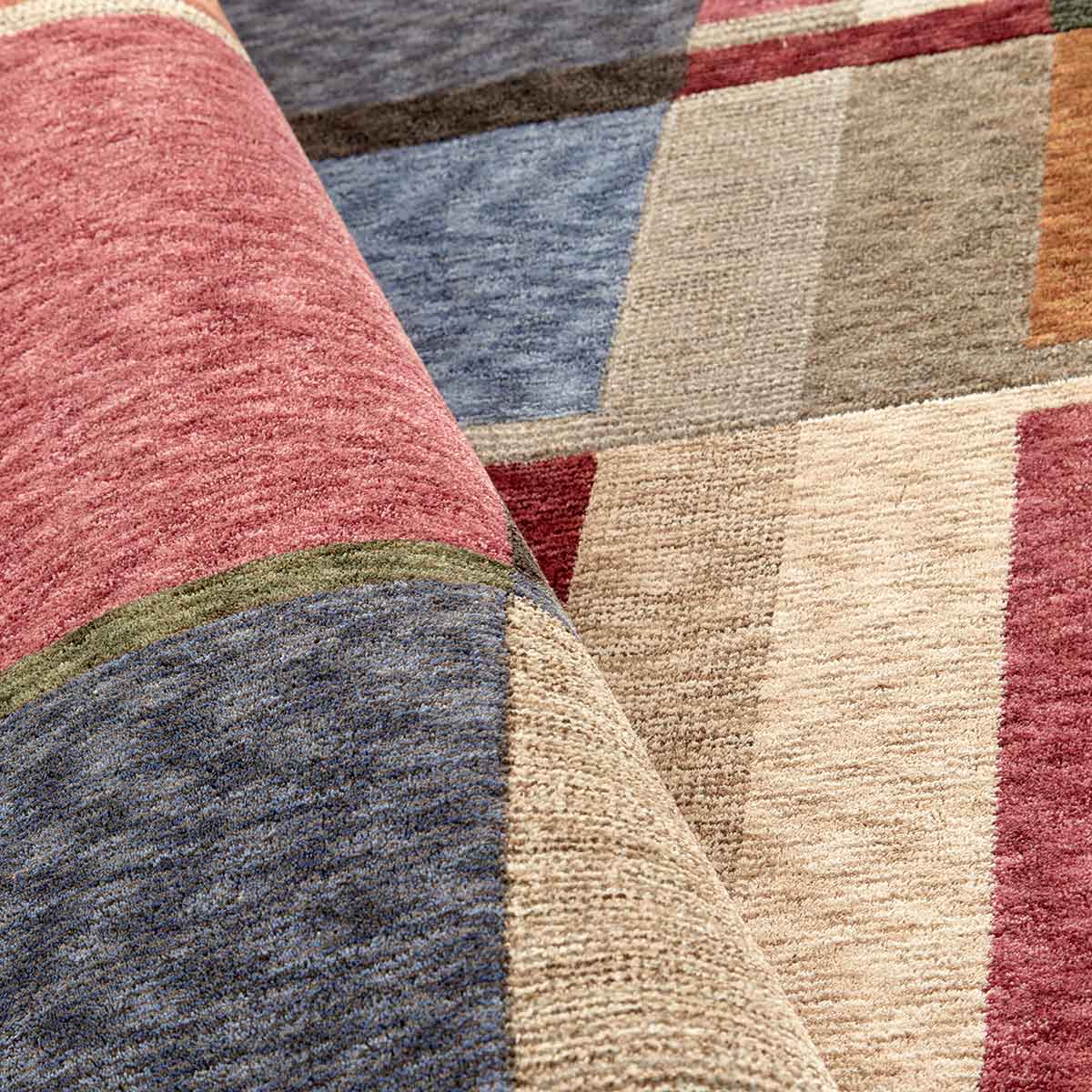 Ophelia Grid contemporary geometric rug featuring layered earthy tones and architectural lines.