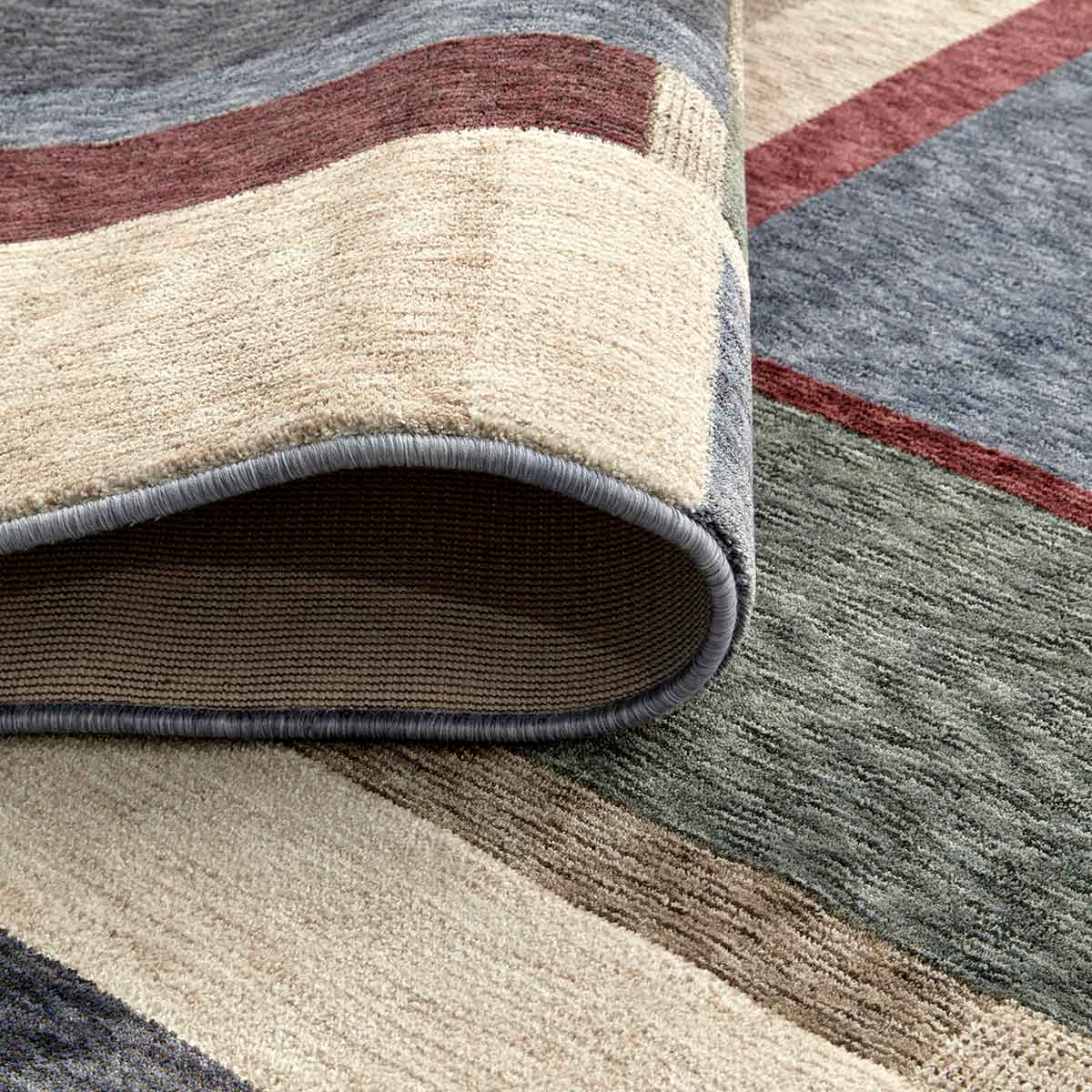 Ophelia Grid contemporary geometric rug featuring layered earthy tones and architectural lines.