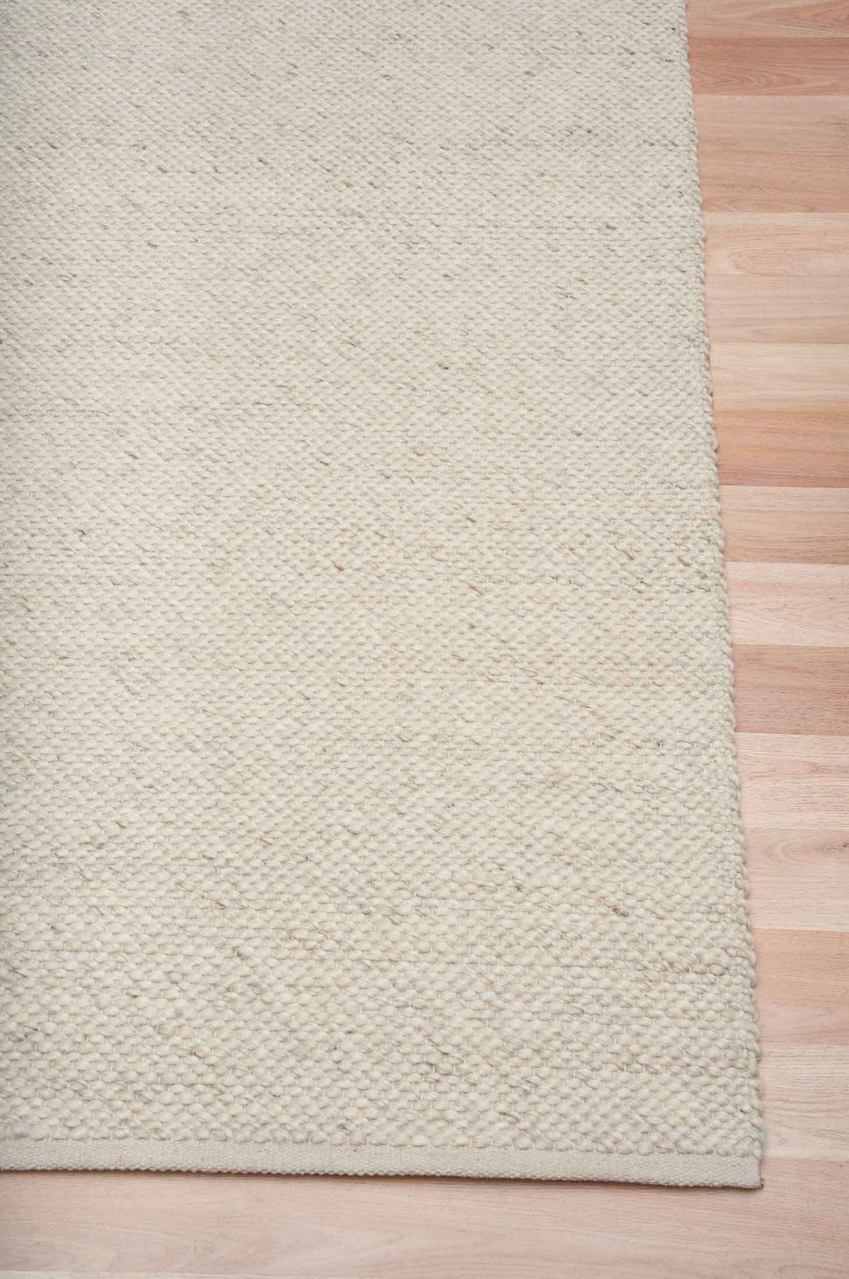 Morris Pearl textured wool rug with handwoven finish in a soft neutral tone, available at Rugs N Timber Belrose showroom