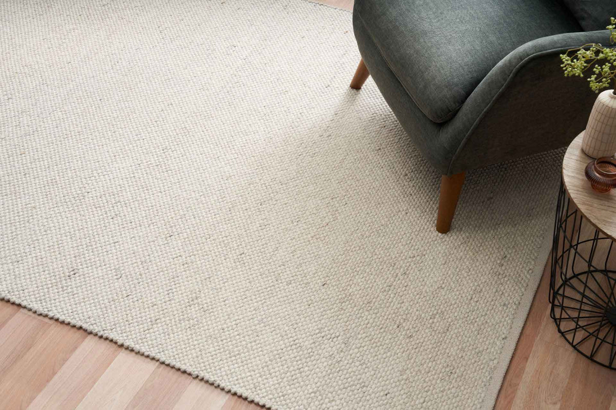 Morris Pearl textured wool rug with handwoven finish in a soft neutral tone, available at Rugs N Timber Belrose showroom