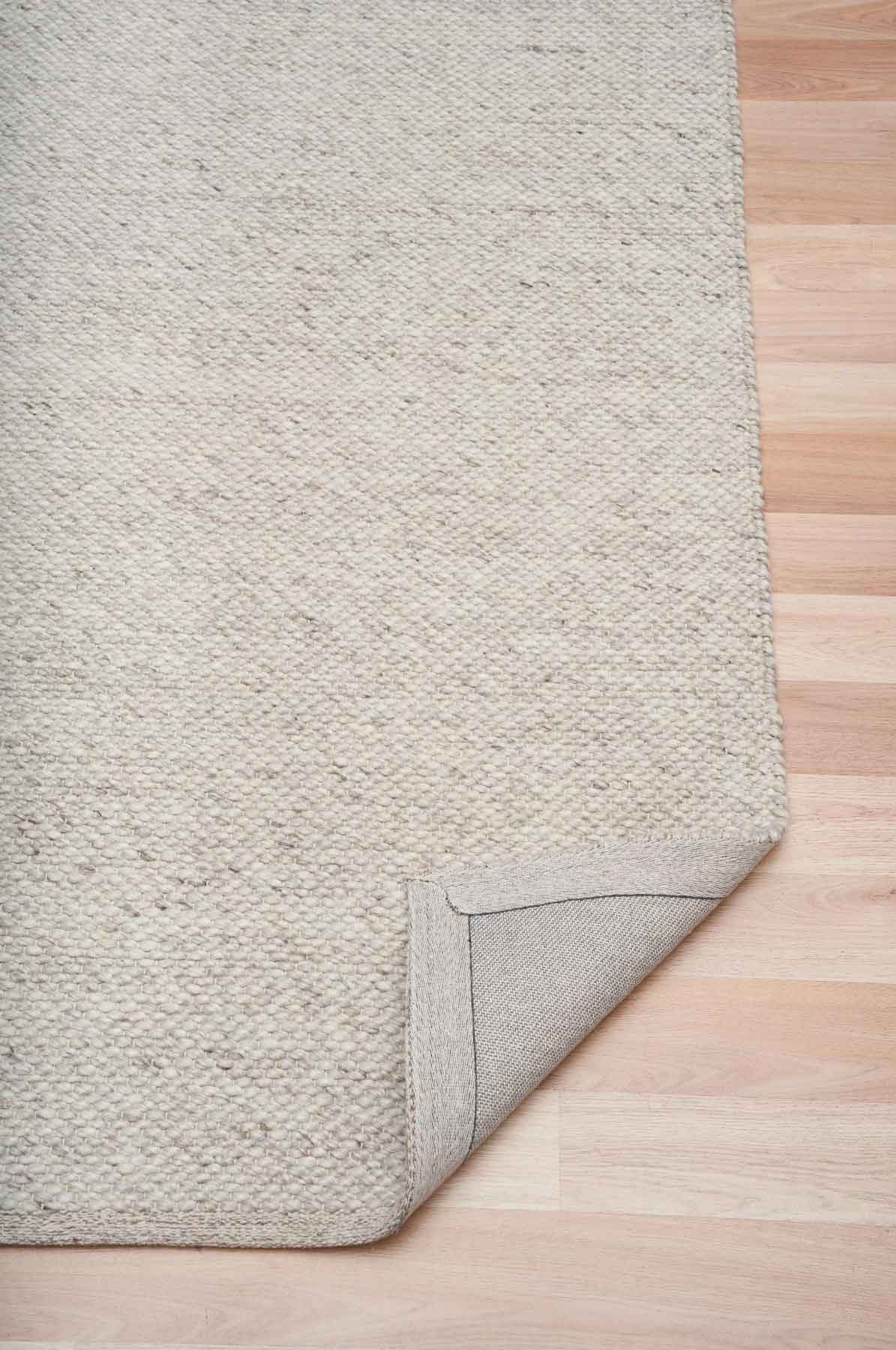 Morris Stone textured wool rug featuring a natural handwoven finish, view in person at Rugs N Timber Belrose showroom