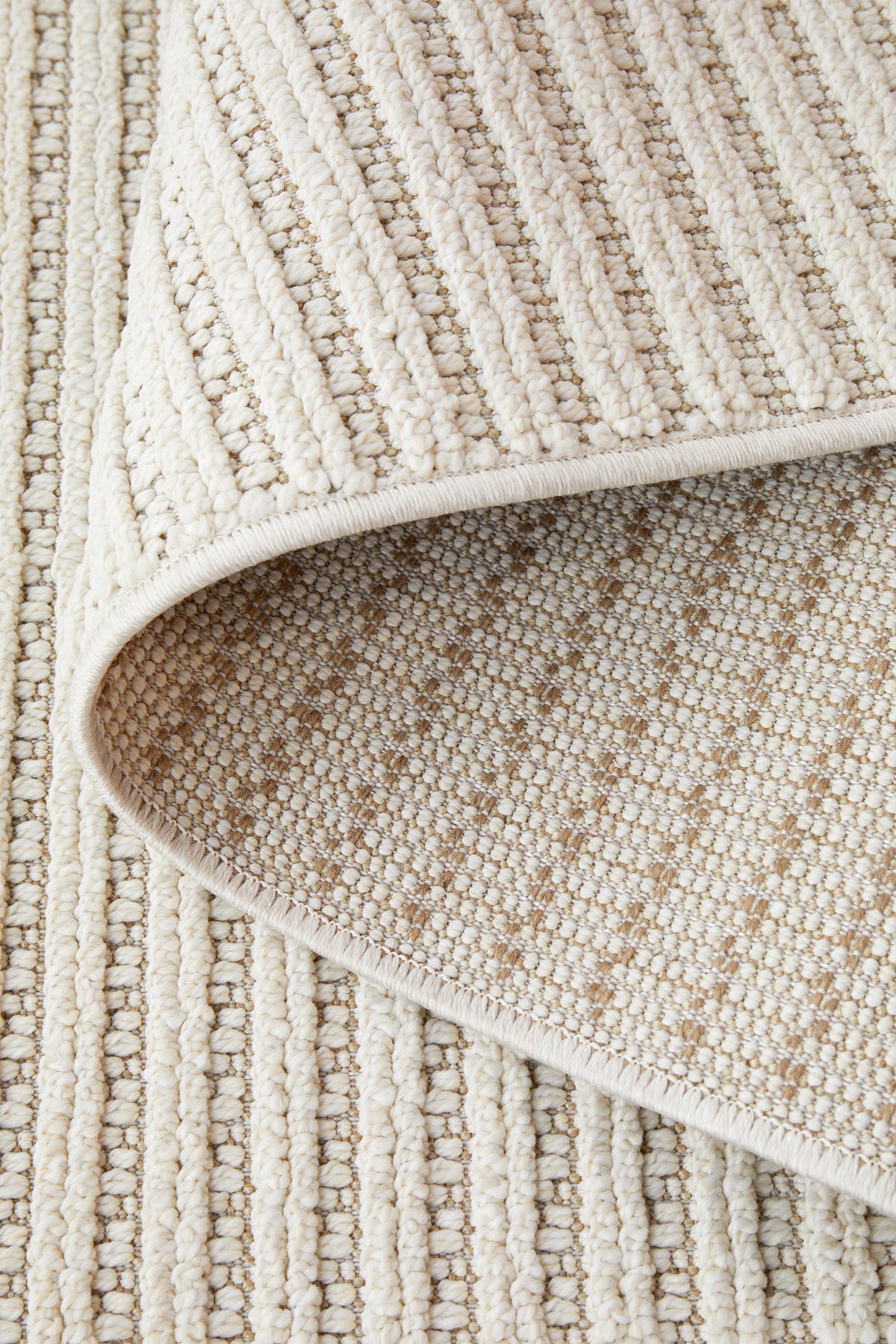 Serafina Cloud indoor and outdoor rug with textured linear design available at Rugs N Timber Belrose showroom