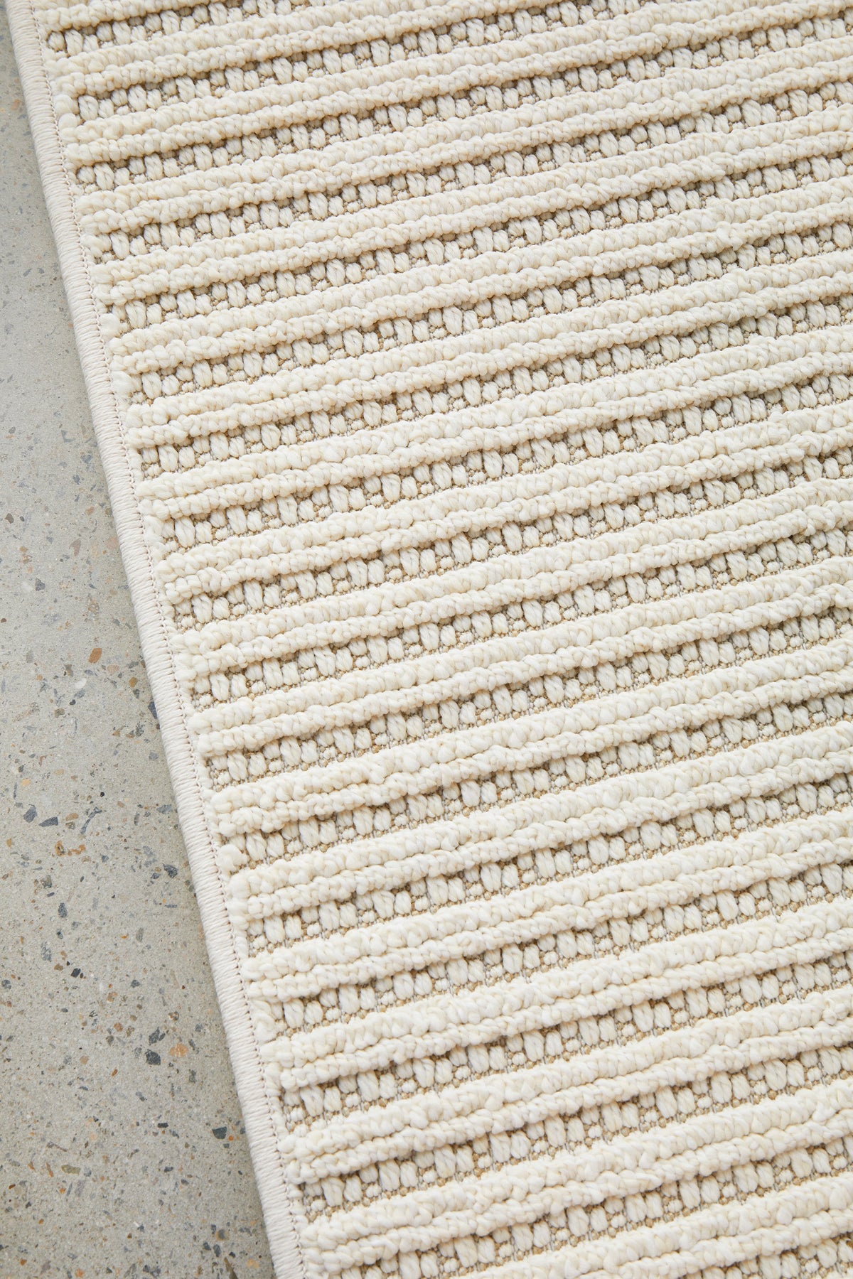 Serafina Cloud indoor and outdoor rug with textured linear design available at Rugs N Timber Belrose showroom
