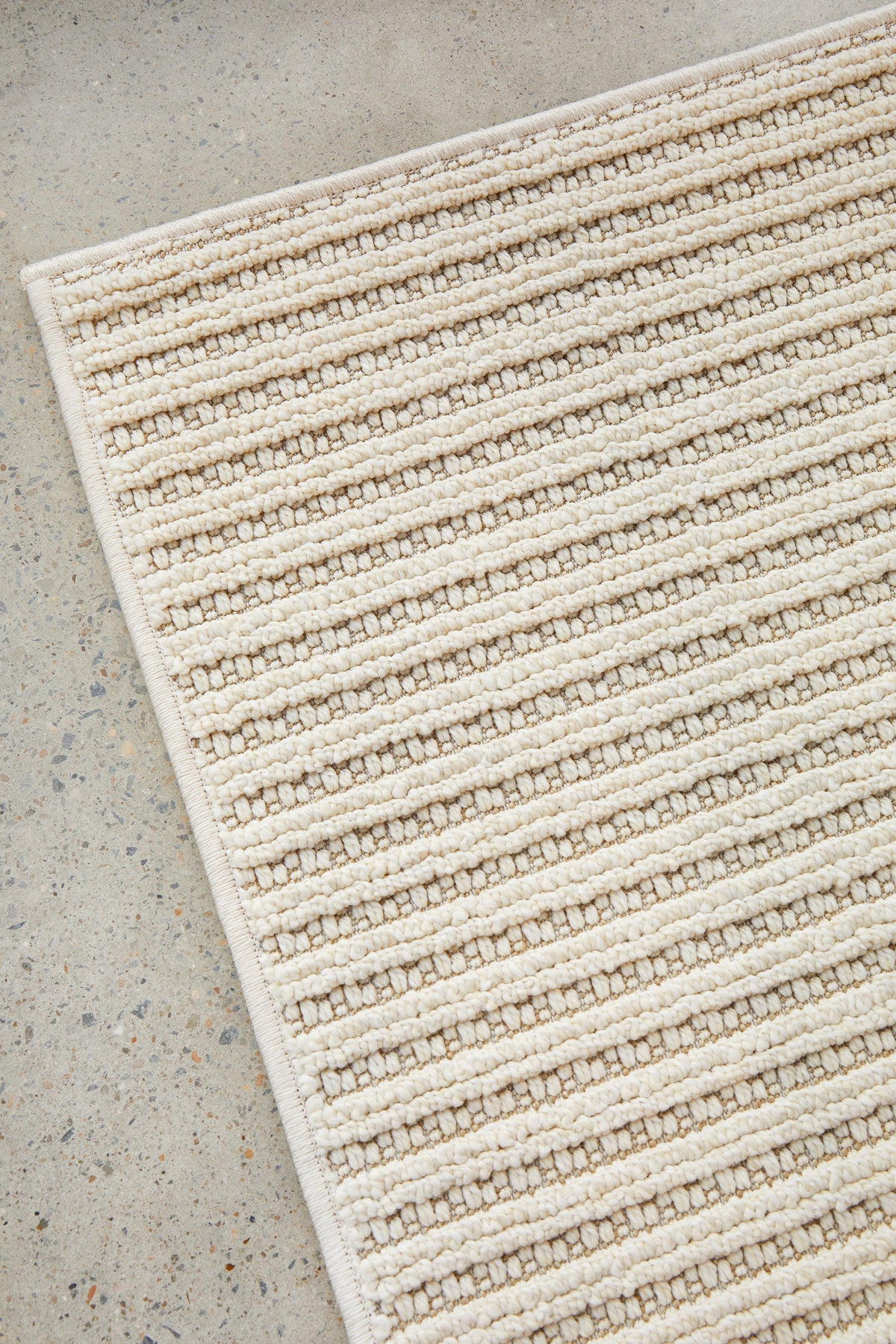 Serafina Cloud indoor and outdoor rug with textured linear design available at Rugs N Timber Belrose showroom