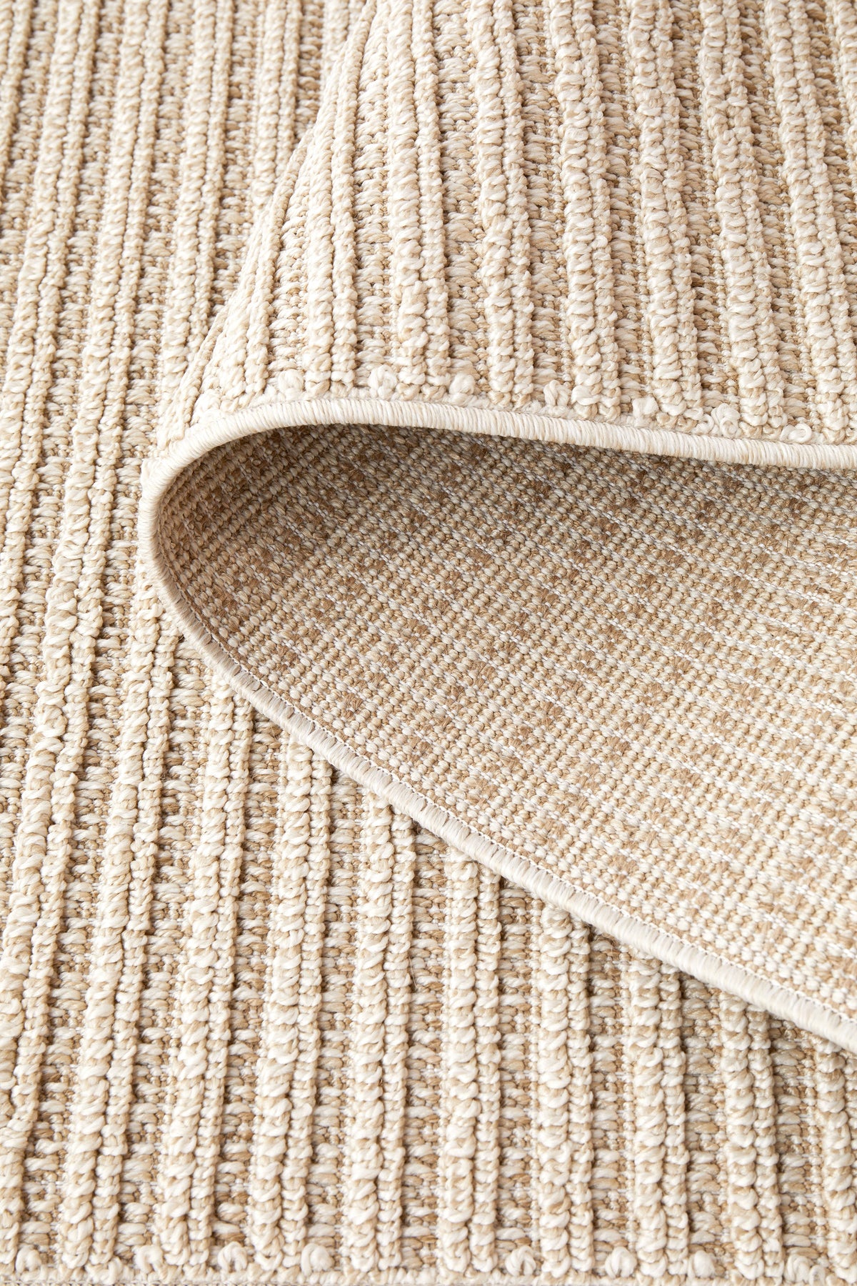 Serafina Latte indoor and outdoor rug with textured linear pattern at Rugs N Timber Belrose showroom