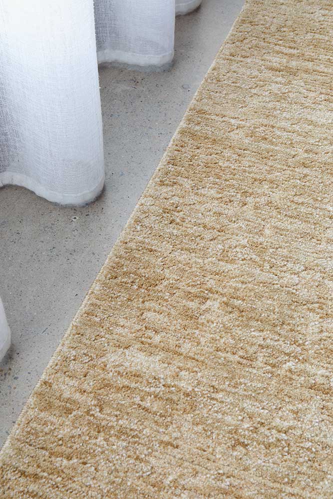 Close-up of Steph & Gian Willow Wheat rug showing subtle irregular texture, on display in Belrose