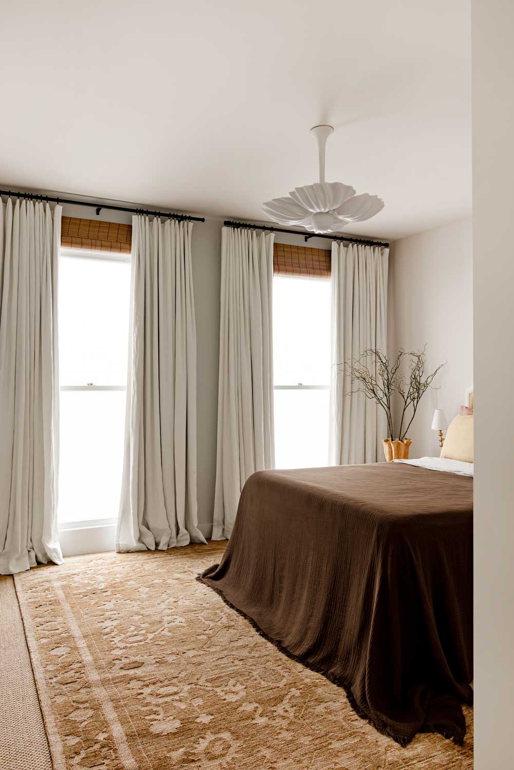 Vivienne Manor traditional distressed rug featuring warm neutral tones and a classic floral pattern.